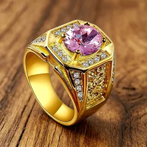 Close-up of men's retro engraved gold ring featuring a large round pink zircon