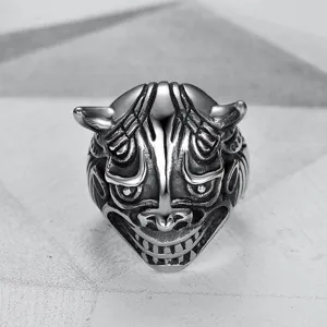 Detailed macro view of vintage carved monster bull head ring in polished stainless steel
