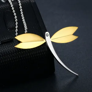 Detailed view of elegant dragonfly pendant in stainless steel with gold wings