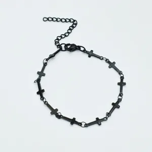 Close-up detail shot of the black stainless steel cross link bracelet showcasing fine links.