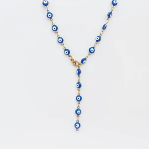 Detailed closeup of the stainless steel evil eye Y-shaped necklace with blue and white beads.