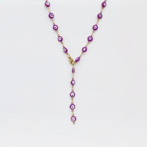 Close-up detail of a stainless steel purple evil eye Y necklace, dainty chic collarbone chain.