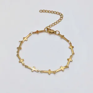 Stainless steel cross bracelet detail view, minimalist religious style gold link jewelry piece.