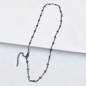 Stainless steel black cross chain detail view, punk style fashion jewelry accessory.
