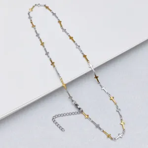 Stainless steel cross chain necklace detail view, two-tone silver and gold design.