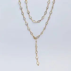 Gold stainless steel Y-shaped layered station necklace with clear crystal stones.