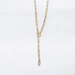 Gold paperclip chain Y necklace with heart detail, delicate metal jewelry for daily wear.