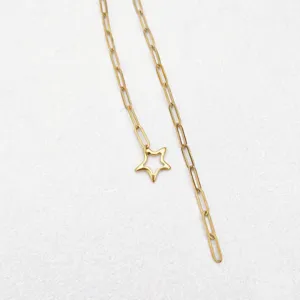 Gold paperclip chain necklace detail showing hollow star pendant fashion jewelry style.