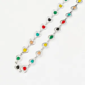 Close-up detail view of the stainless steel colorful enamel heart link chain fashion jewelry.
