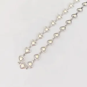 Stainless steel heart link bracelet or necklace with white enamel detail, fashion jewelry.
