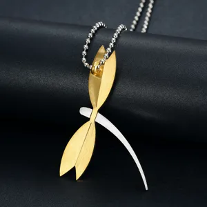 Detailed view of a two-tone brushed steel dragonfly pendant on a metallic ball chain