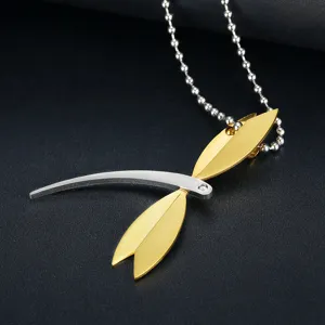 Detailed view of elegant gold and silver dragonfly pendant with crystal on bead chain