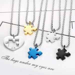 Detailed view of stainless steel jigsaw puzzle piece pendant necklaces in multiple colors