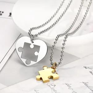 Detailed macro view of high-quality stainless steel heart puzzle couple necklaces