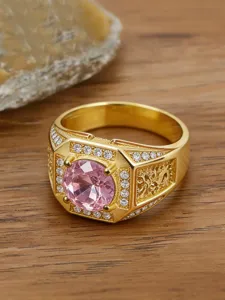 Close-up of a vintage stainless steel men's ring with a large pink zircon stone.