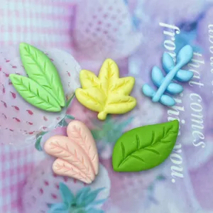 Matte resin leaf and maple leaf charms for phone case DIY craft accessories details view.