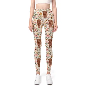 Detail view of high-waist yoga leggings featuring a Highland cow and floral print design