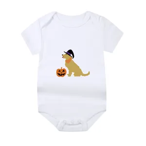 Detail view of a soft white cotton baby onesie featuring a Halloween dog and pumpkin print