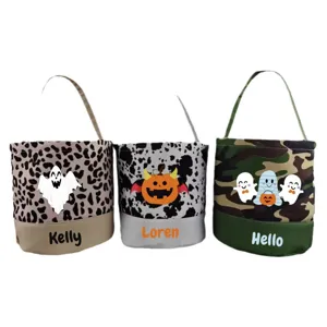 Customized Halloween canvas candy buckets with ghost and pumpkin prints for party