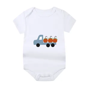 White newborn baby bodysuit featuring a cute blue truck and pumpkin print detail view