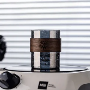Vintage smoke grey heat-resistant glass water cup with insulated wooden sleeve