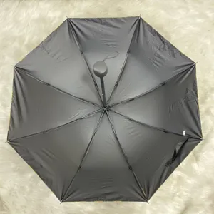 Interior view of black vinyl coated folding umbrella with sturdy manual frame structure