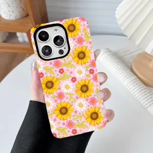Close-up of vibrant sunflower and floral print pattern on a pink phone case