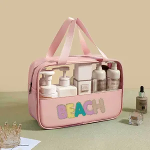 Detailed close-up view of the large capacity pink PVC toiletry bag with colorful BEACH patch