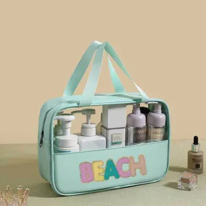 Large mint green PVC semi-transparent beach wash bag filled with skincare bottles