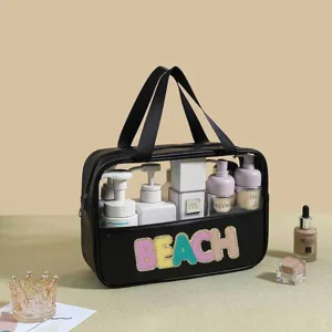 Detail view of the large capacity PVC wash bag with a colorful glitter BEACH patch