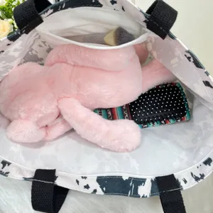 Detailed view of large capacity tote bag interior with mesh pocket and lining