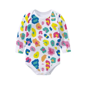 Detailed view of white baby long-sleeve bodysuit featuring colorful abstract leopard pattern