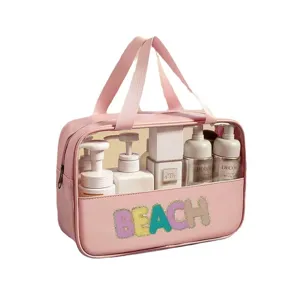 Large pink PVC waterproof wash bag with sequined BEACH lettering for travel