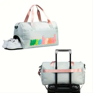 Detailed views of light blue gym bag with shoe compartment and luggage trolley sleeve