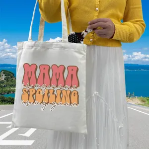 Sturdy canvas tote bag featuring MAMA SPOILING IS MY GAME print for daily shopping
