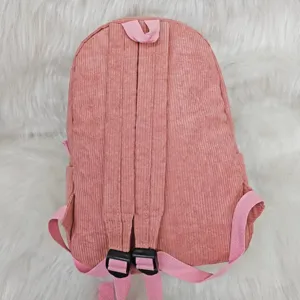 Detailed back view of a pink corduroy children's backpack with adjustable shoulder straps.