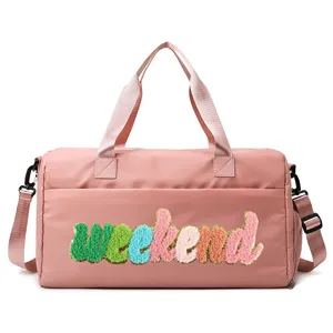 Pink sports fitness travel bag featuring colorful chenille 'weekend' embroidery detail