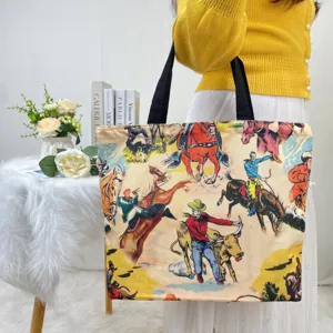 Detail of large canvas tote bag featuring vintage western cowboy and rodeo print