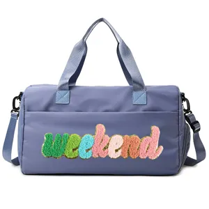 Front view of blue sport weekend duffel bag with colorful chenille patch lettering