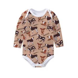 Long sleeve baby onesie with brown cow and cowpuncher print on a soft beige base.