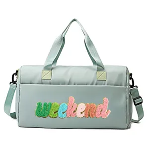 Close-up view of the vibrant colorful chenille weekend patch on light green bag