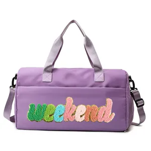 Close-up detail of a purple sports gym bag featuring a colorful weekend chenille patch.