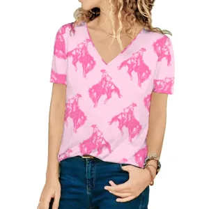 Detail view of women's loose V-neck T-shirt with hot pink western cowboy print