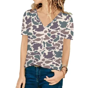 Detailed view of women's loose V-neck T-shirt featuring a subtle camouflage pattern