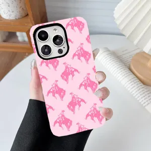 Detailed view of pink 2-in-1 phone case with hot pink cowboy pattern held in hand