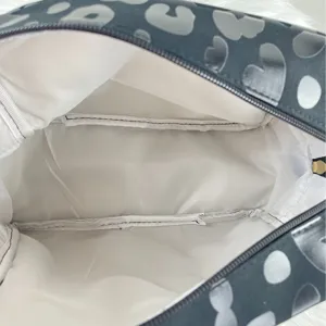 Large leopard heart print travel cosmetic bag with a spacious white interior lining for storage