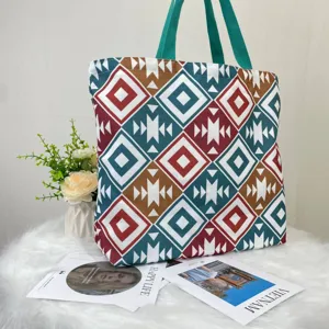 Large capacity canvas tote bag with colorful geometric tribal print and green straps
