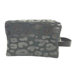 Large leopard print travel cosmetic bag with convenient side handle for organization.