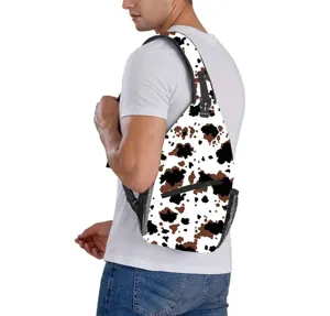 Detailed view of the stylish cow print pattern on a sling bag worn by a male model
