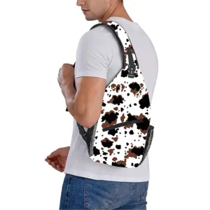 Western style cow print sling bag worn by a male model against a clean white background
